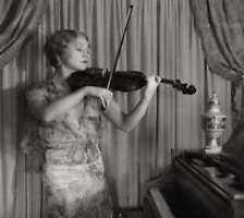 She can also play the violin. She entered the entertainment business as a teenage violinist in vaudeville.